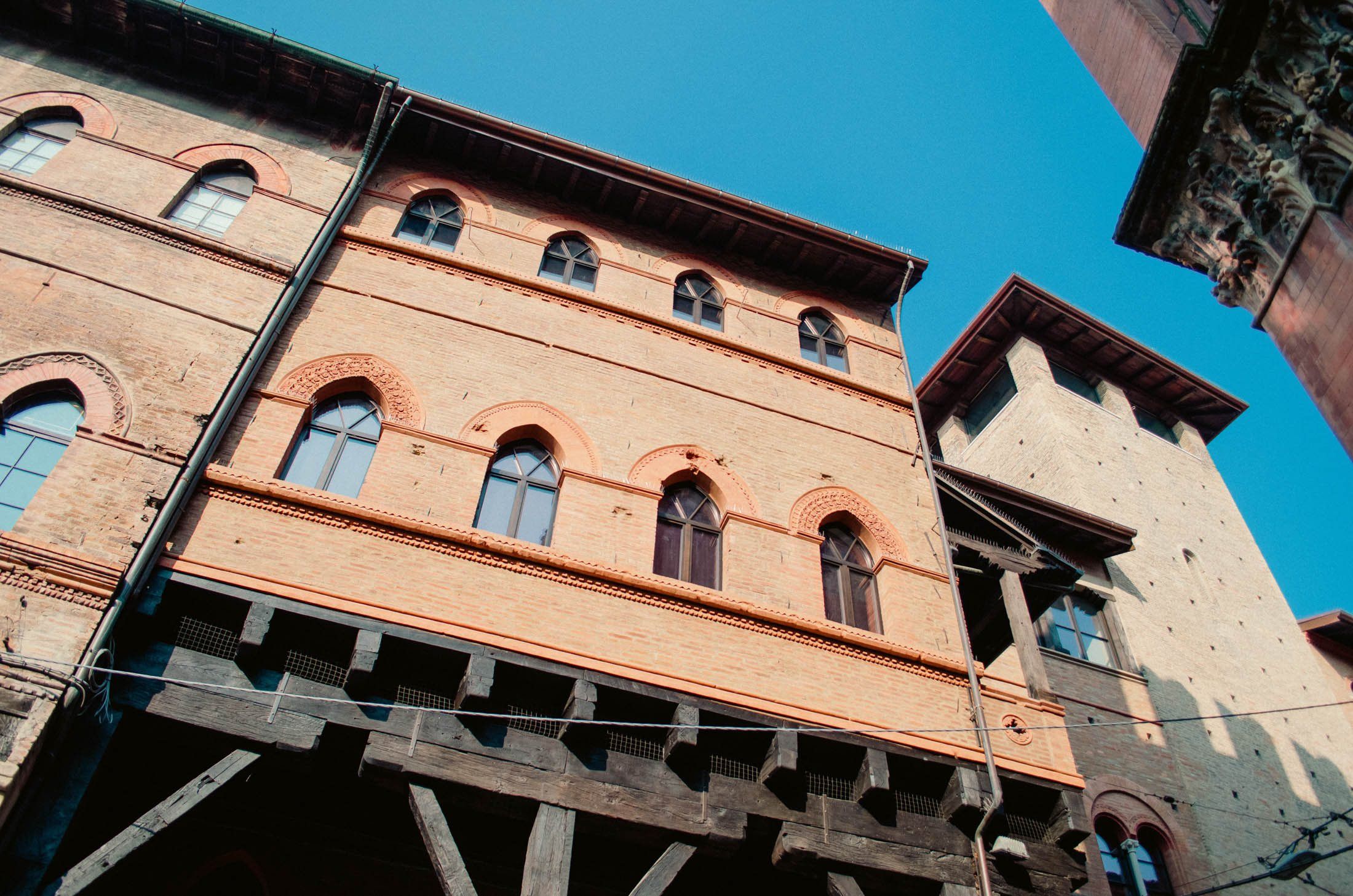 Medieval brick palazzo with a wooden portico in Bologna