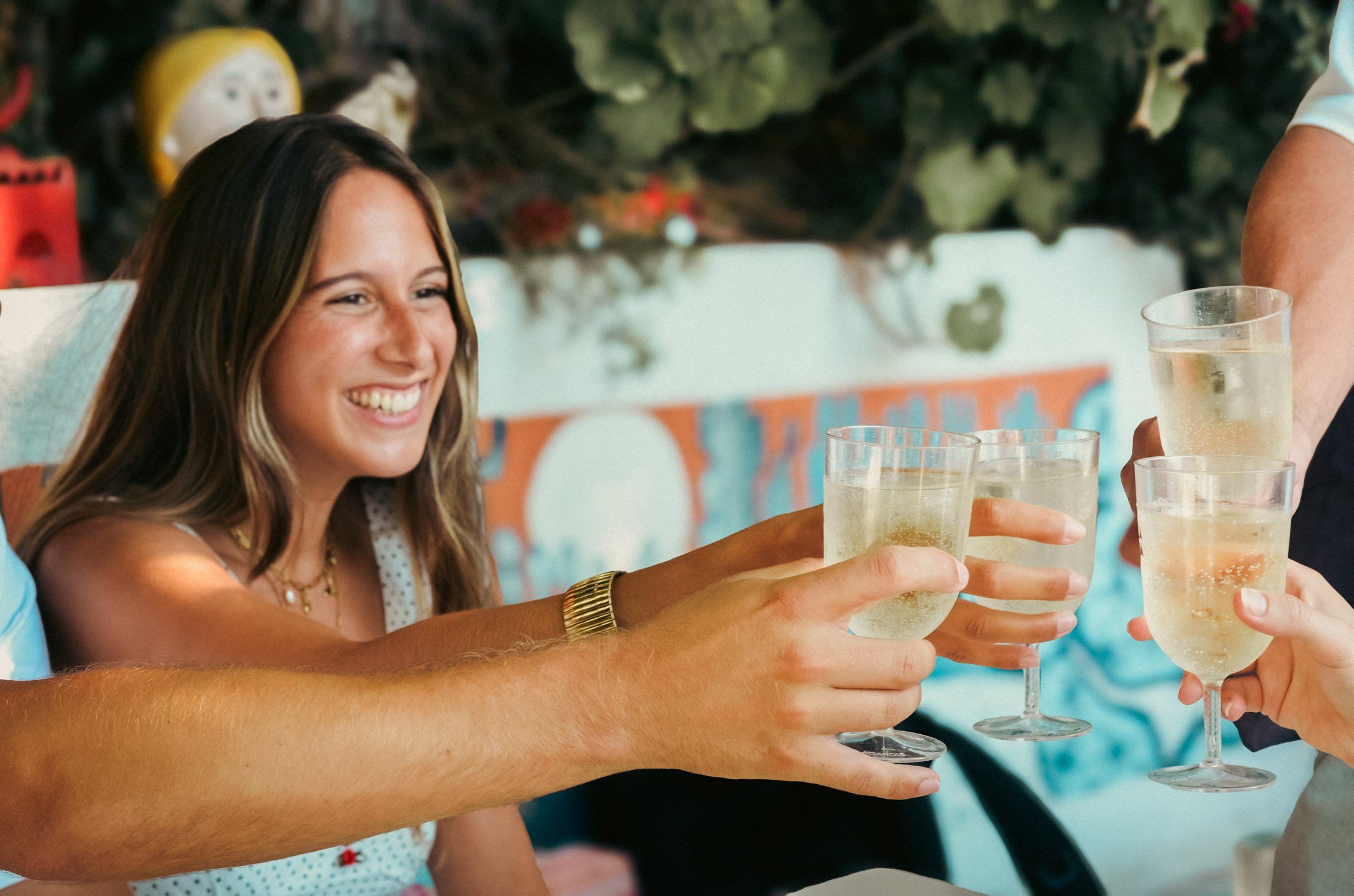 Friends toasting with sparkling wine at aperitivo