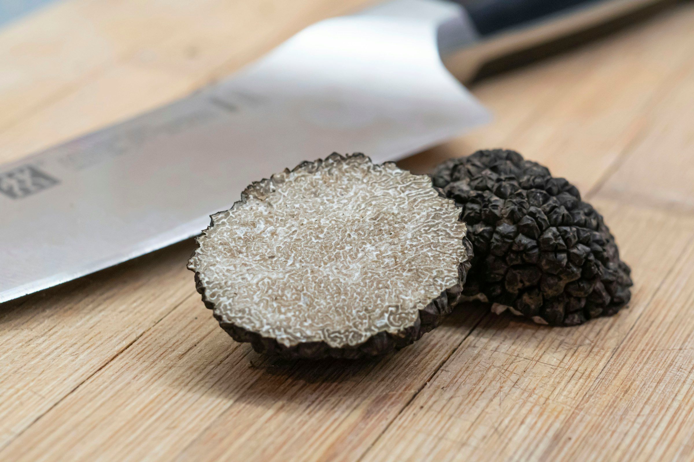 A freshly found truffle on a wooden board